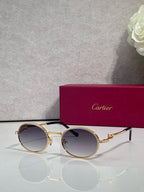 Cartier round eyeglasses with gold frame, dark blue tinted lenses, black arms