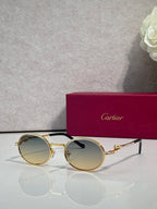 Cartier round eyeglasses with gold frame, warm gold tinted lenses, black details
