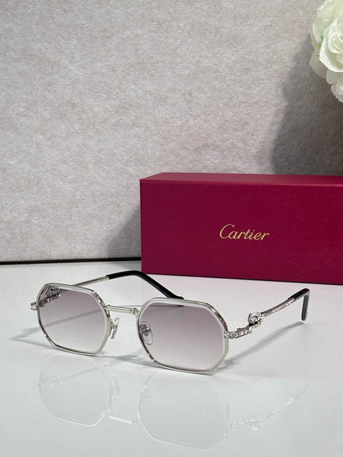 Cartier eyeglasses with silver round frames and clear gray lenses, black temple arms.