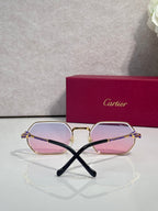 Cartier eyeglasses with rose-pink lenses and light gold frames, black temple arms.