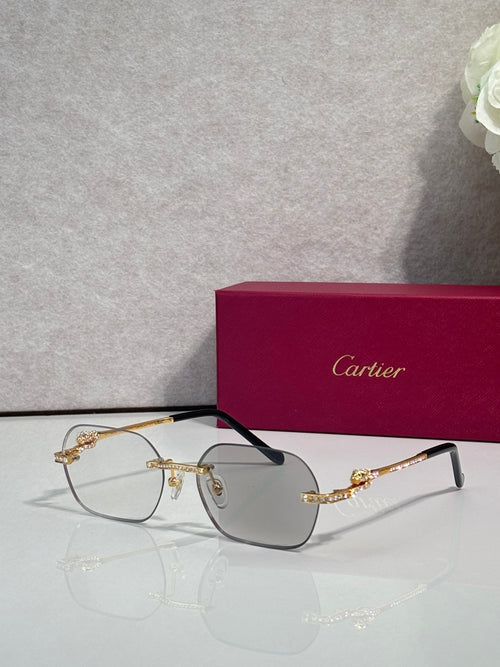 Gold metal eyeglasses with light tinted lenses and black temple tips