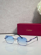 Cartier eyeglasses with black-and-gold frame, blue gradient lenses and rhinestone accents