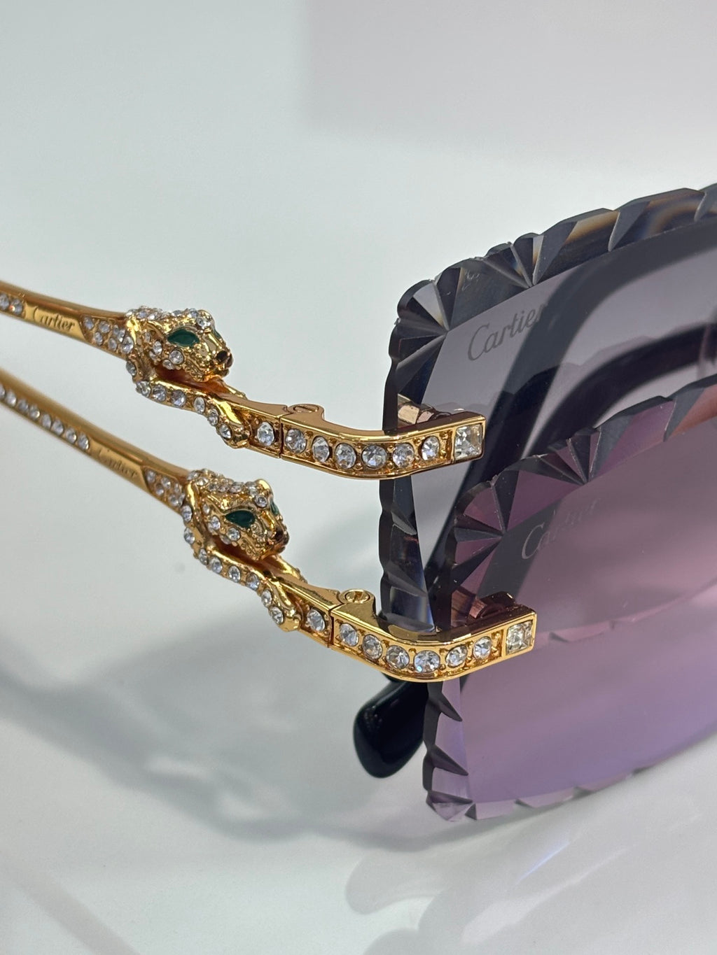 Cartier gold-tone frame detail with sparkling crystal accents on bridge and temple