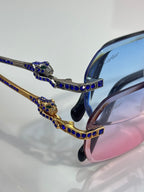 Cartier eyeglasses close-up of blue jeweled bridge and gold frame