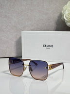 Celine sunglasses with dark blue frames, gold accents, and gradient tinted lenses.