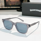 Gray square sunglasses with blue-tinted lenses and silver patterned temple accents
