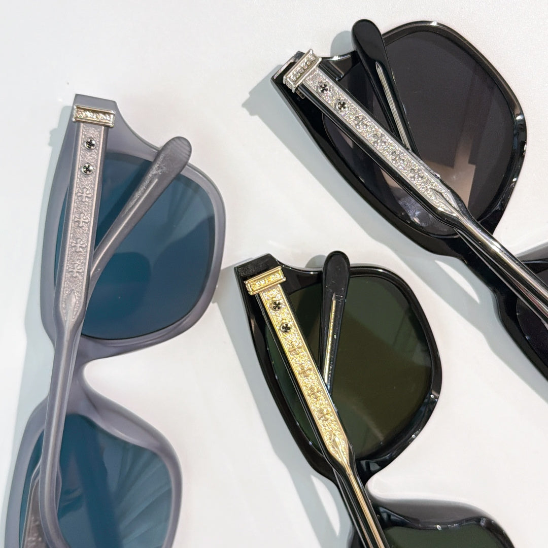Assorted sunglasses in blue, green, and black with patterned gold-tone temple bars