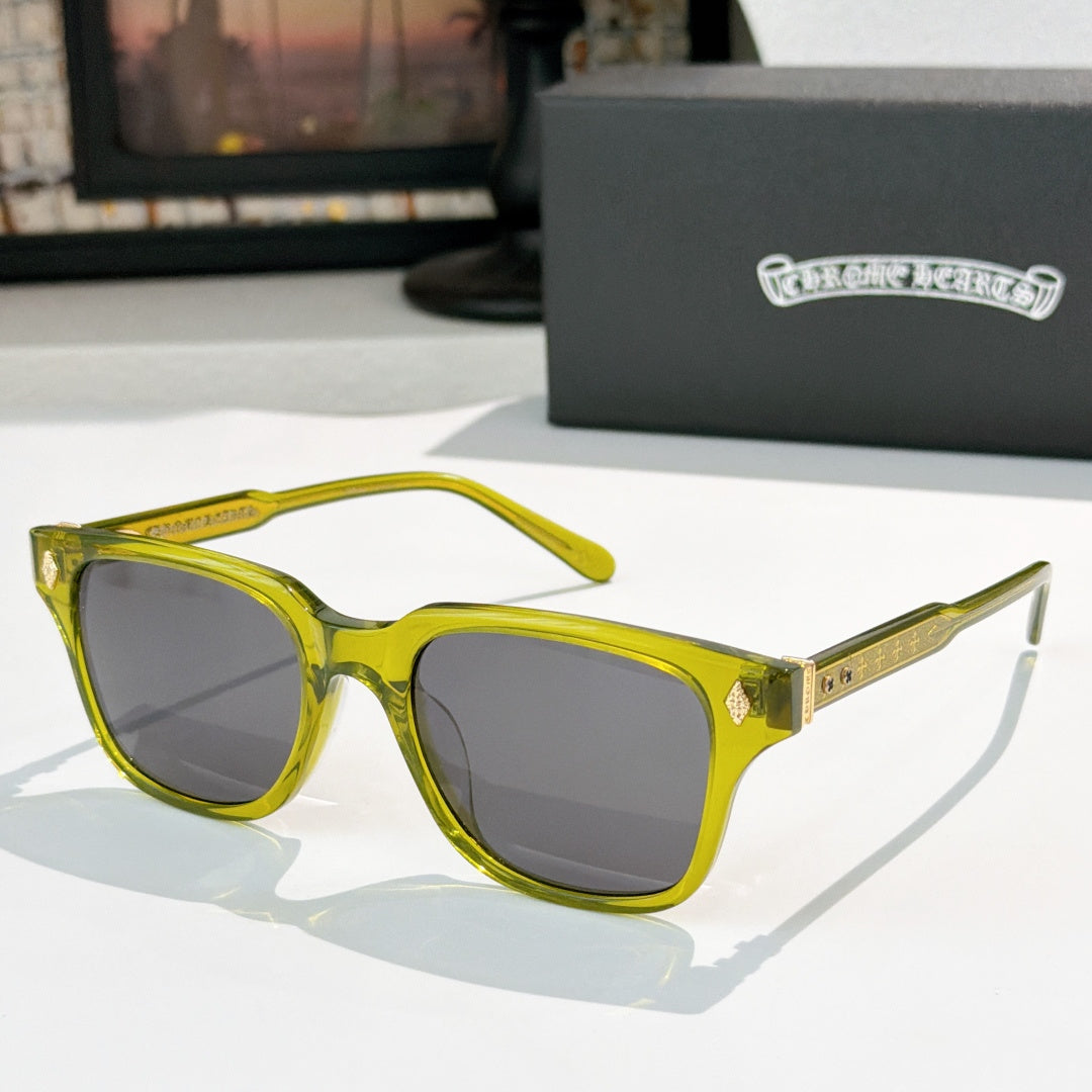 Yellow square sunglasses with dark tinted lenses and gold-tone patterned temple details