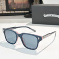 Blue and navy square sunglasses with tinted lenses and silver patterned temple tips