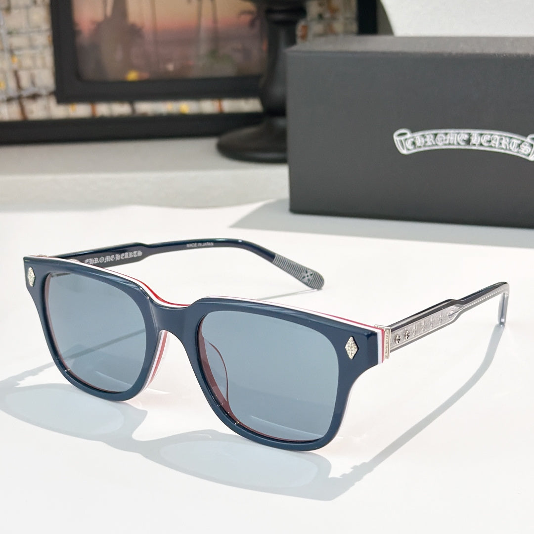 Blue and navy square sunglasses with tinted lenses and silver patterned temple tips