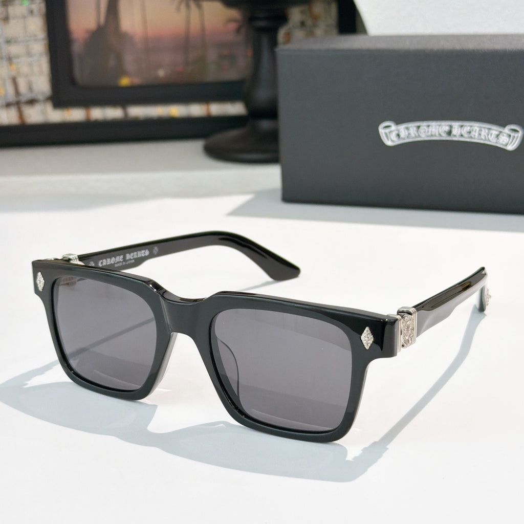 Black square sunglasses with dark lenses and silver-tone accents