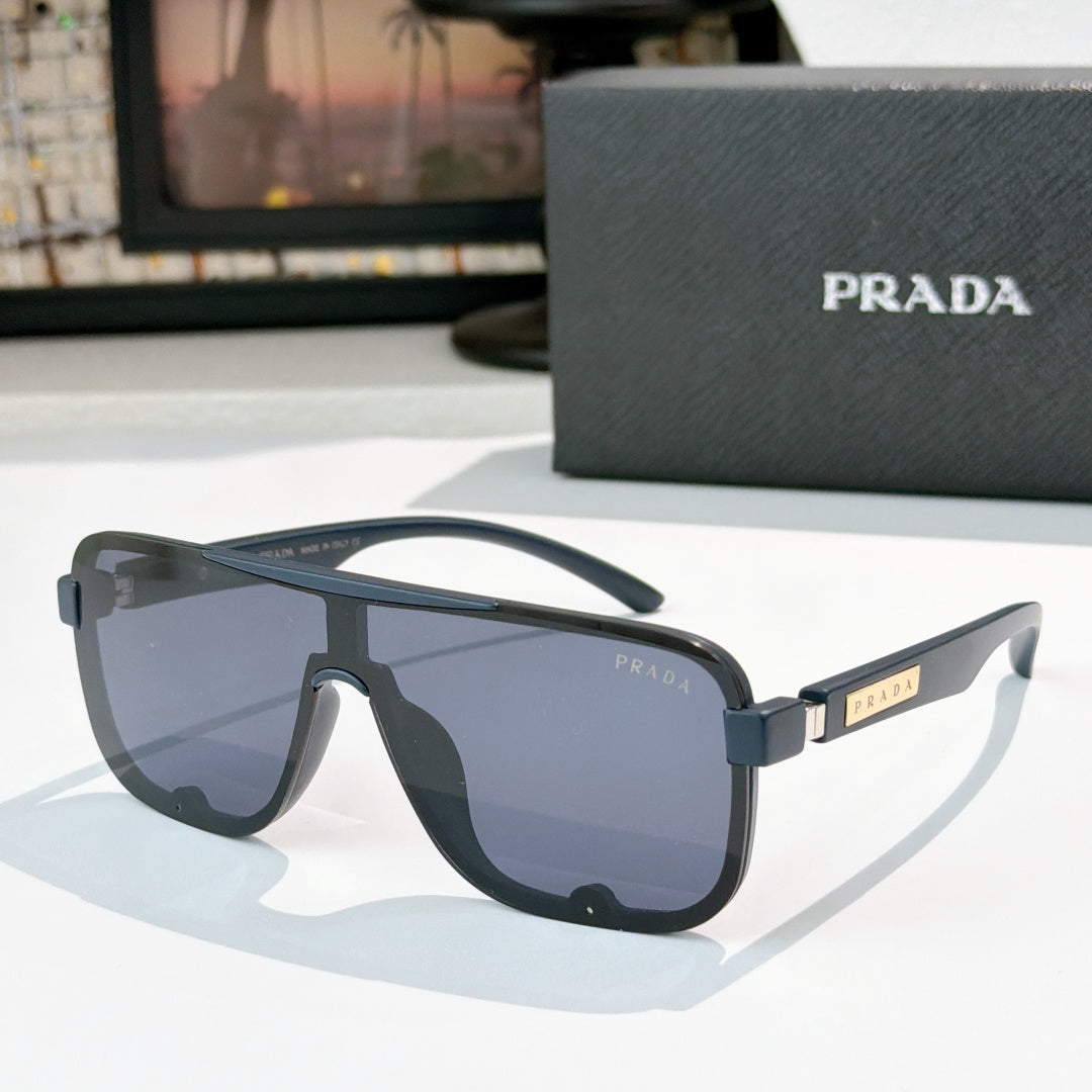 Prada black rectangular sunglasses with dark blue gradient lenses and gold logo temple