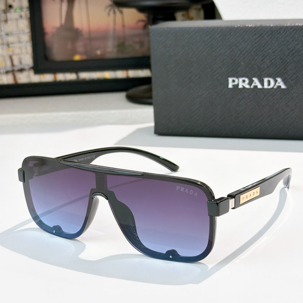 Prada black rectangular sunglasses with blue gradient lenses and gold logo temple