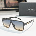 Prada black rectangular sunglasses with brown gradient lenses and gold logo temple