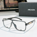 Prada black rectangular sunglasses with clear gray lenses and gold logo temple