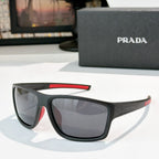 Prada sunglasses with black frame, red accent on upper arm, tinted lenses