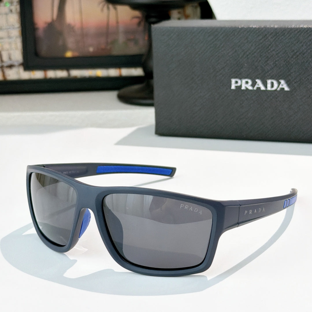 Prada sunglasses with black frame, blue accent on upper arm, tinted lenses
