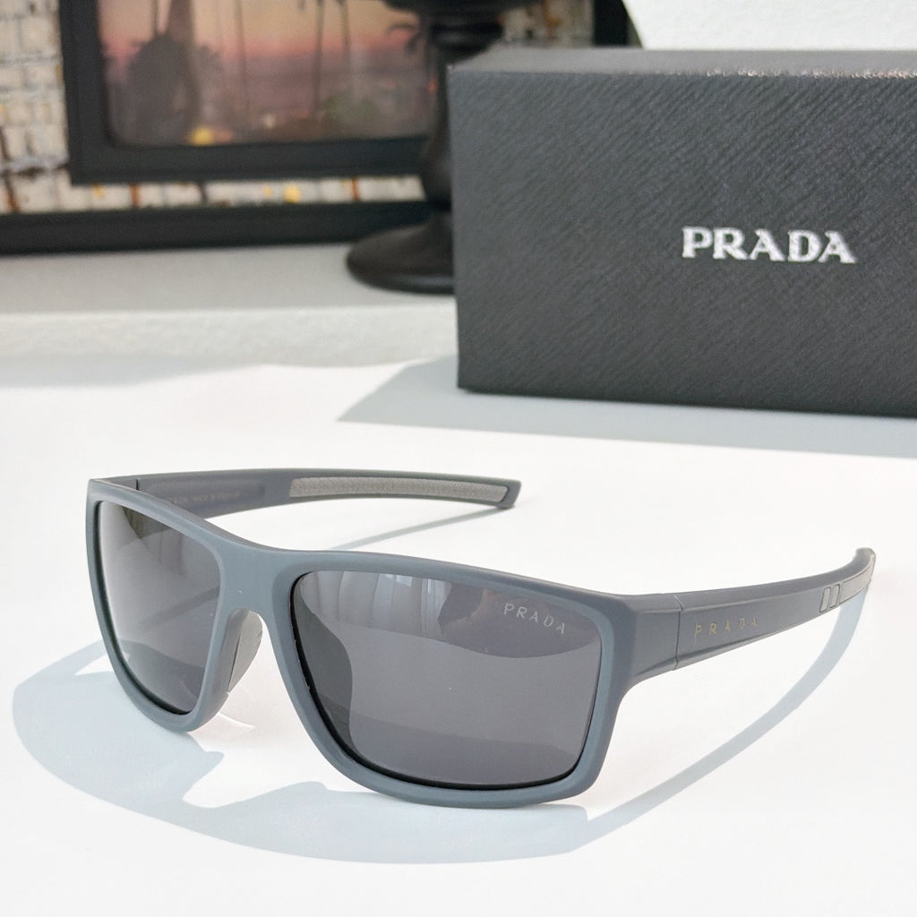Prada sunglasses with dark gray frame and tinted lenses