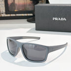 Prada sunglasses with dark gray frame and tinted lenses