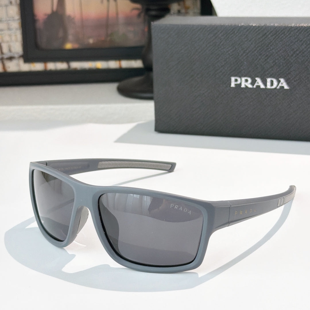 Prada sunglasses with dark gray frame and tinted lenses