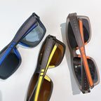Prada sunglasses set of three pairs: blue, brown, and orange frames with tinted lenses