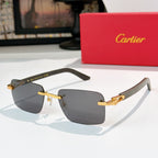 Cartier sunglasses with dark frame, gold temples, and gray gradient lenses