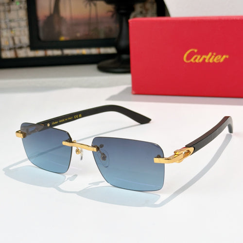 Cartier sunglasses with dark frame, gold temples, and blue gradient lenses