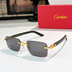 Cartier sunglasses with dark frame, gold temples, and gray gradient lenses
