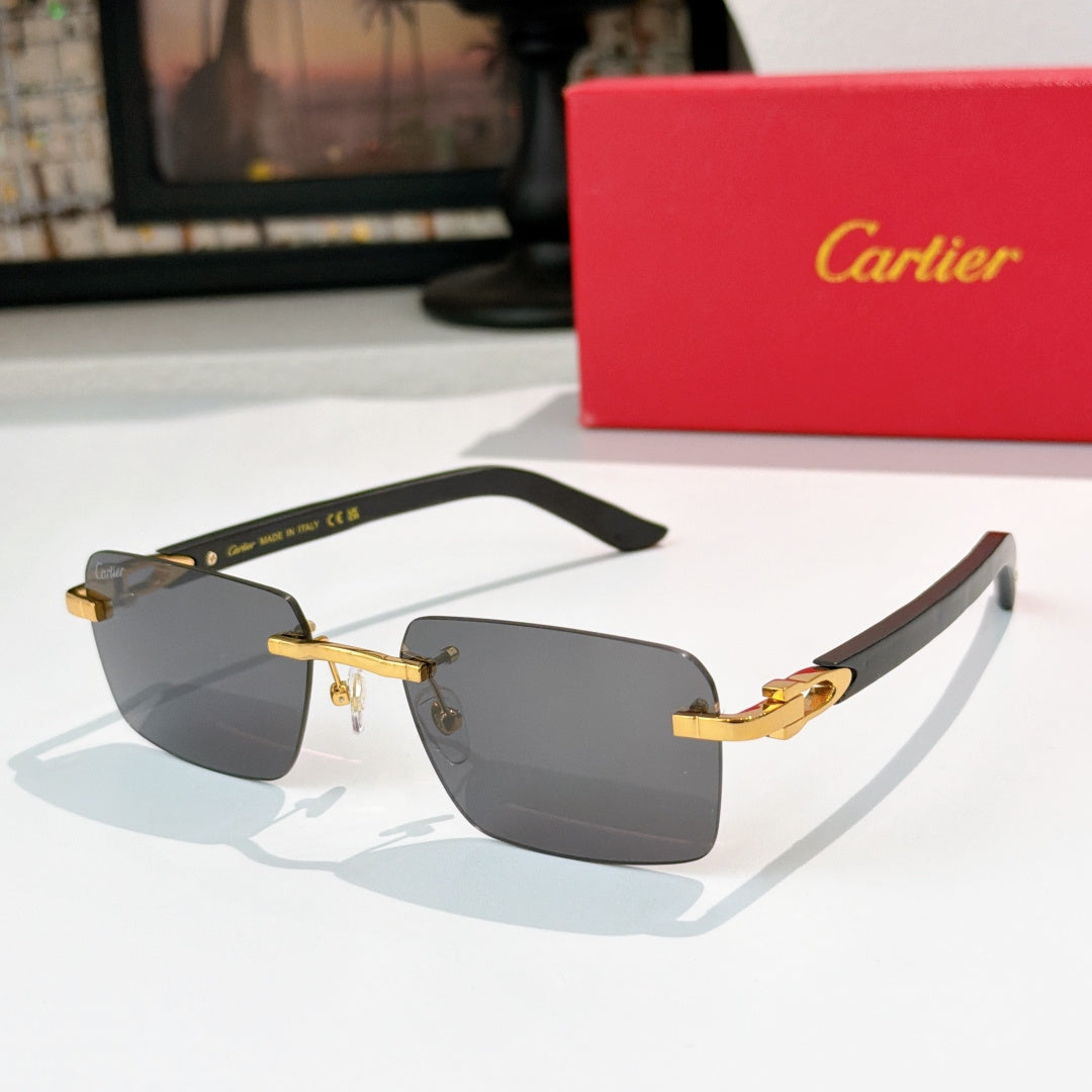 Cartier sunglasses with dark frame, gold temples, and gray gradient lenses