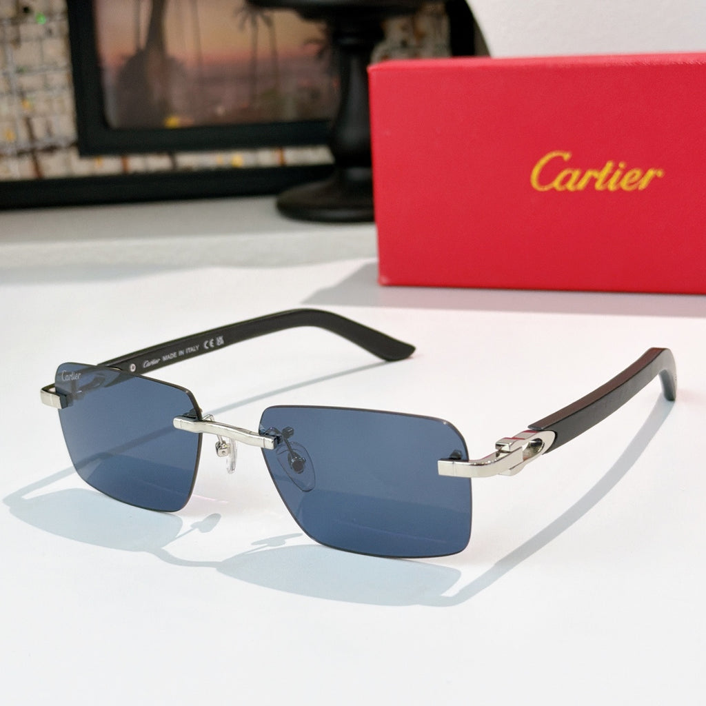 Cartier sunglasses with dark frame, silver accents, and blue gradient lenses