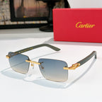 Cartier sunglasses with greenish frame, gold temples, and light blue gradient lenses