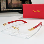 Cartier eyeglasses with clear lenses and gold frame details, red temple arms