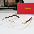 Cartier eyeglasses with clear lenses and gold frame accents, black temple arms