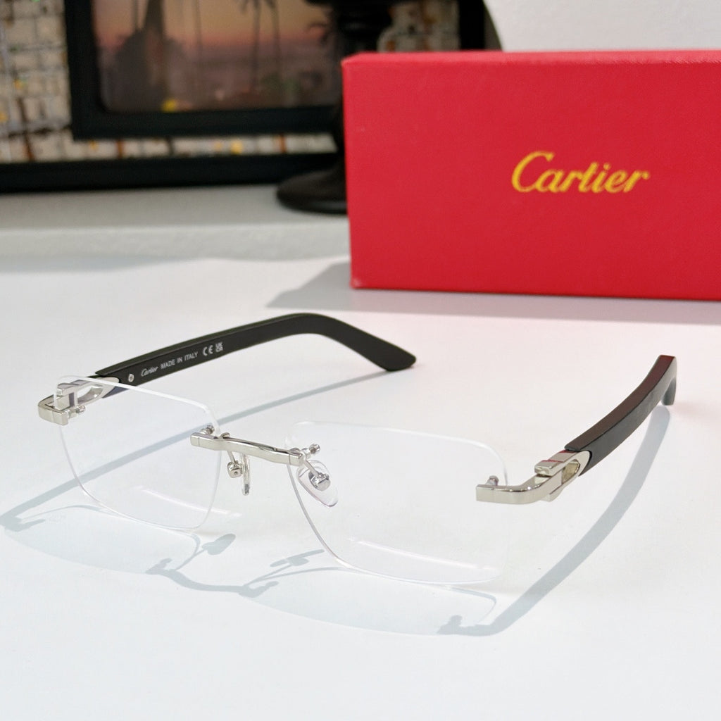 Cartier eyeglasses with clear lenses and silver frame accents, black temple arms