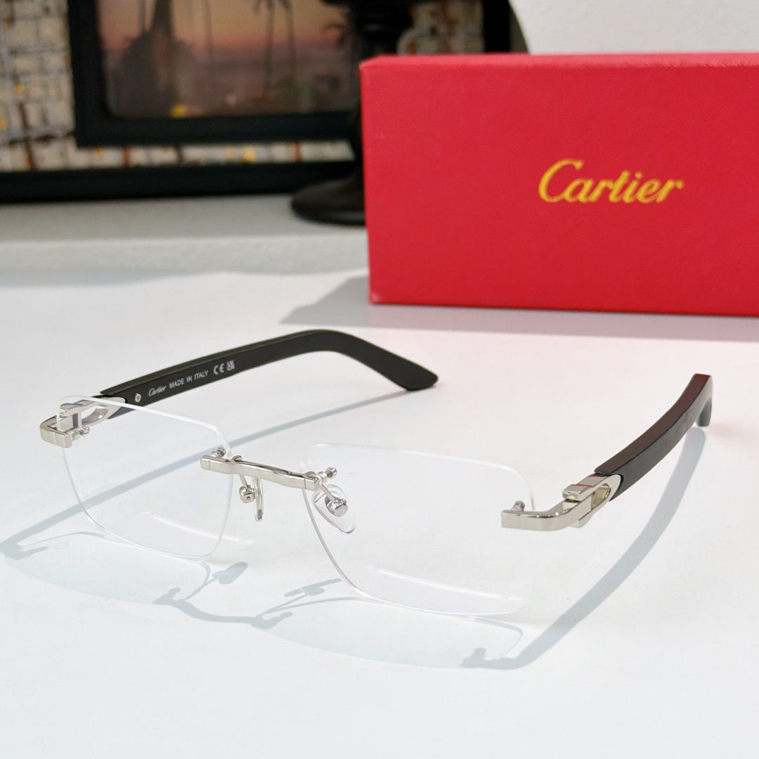 Cartier eyeglasses with clear lenses and silver frame accents, black temple arms