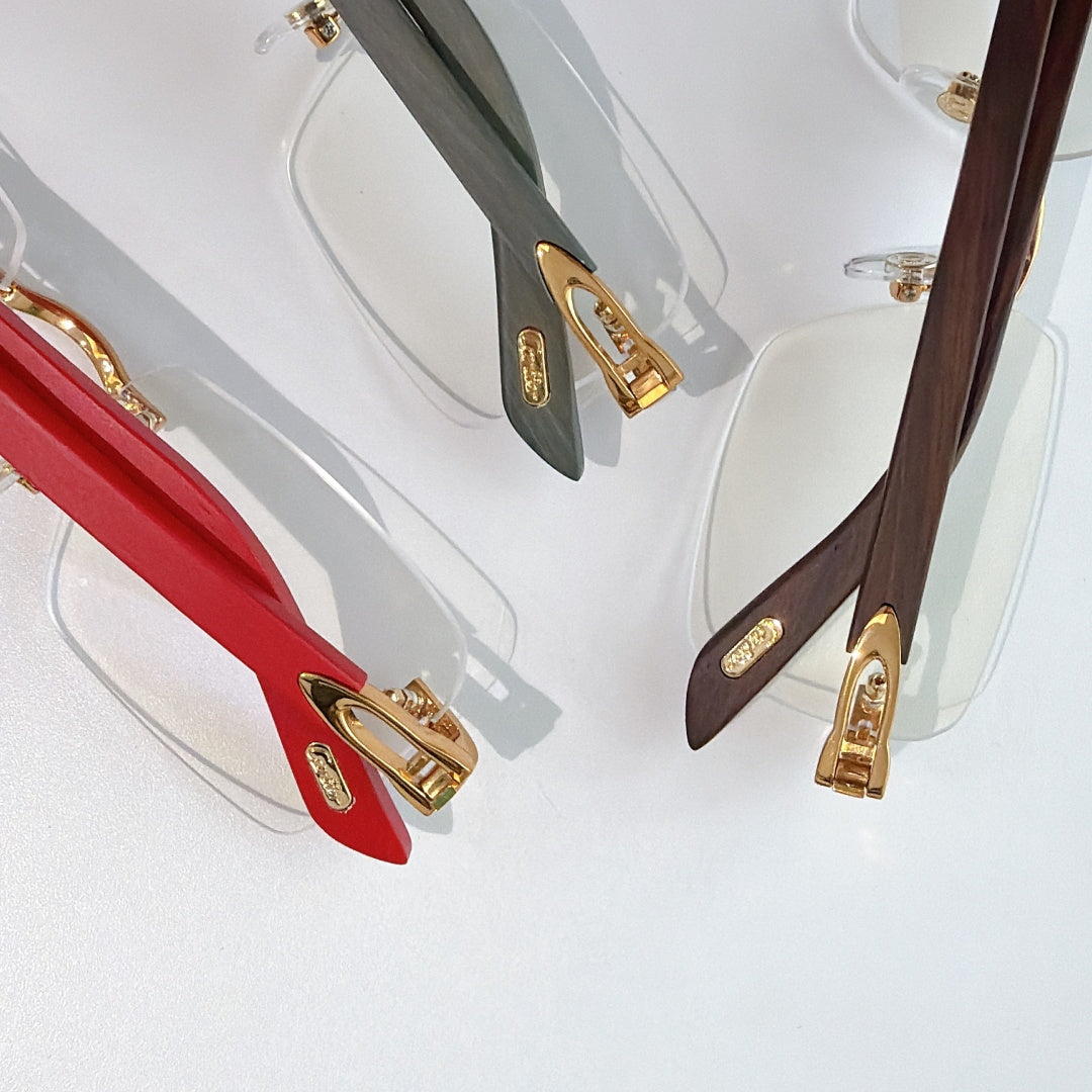 Cartier eyeglasses detail view: red, dark green, and brown temples with gold hinges
