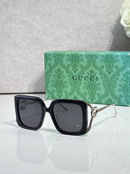 Gucci square sunglasses with black frame and smoky dark lenses