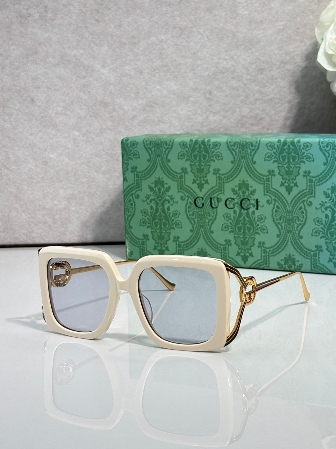 Gucci square sunglasses with cream frame and light blue lenses