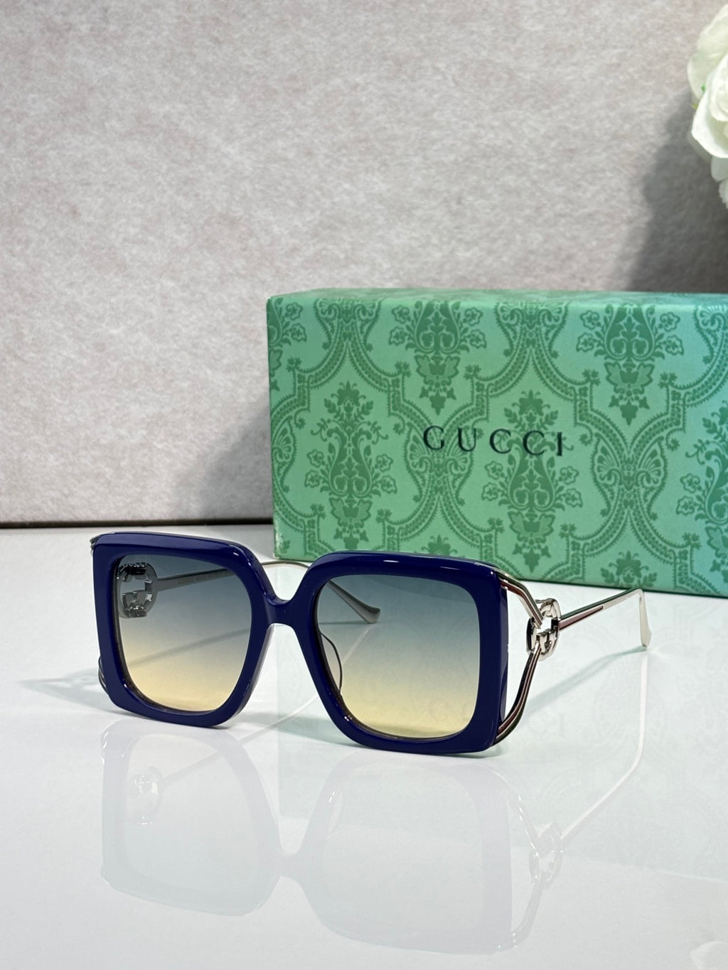Gucci square sunglasses with blue frame and gradient light-blue lenses