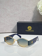 Sunglasses with blue temple accents, dark lenses, gold-tone logo detail
