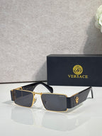 Versace rectangular sunglasses with gold-tone frame and dark blue lenses, tortoiseshell side panels