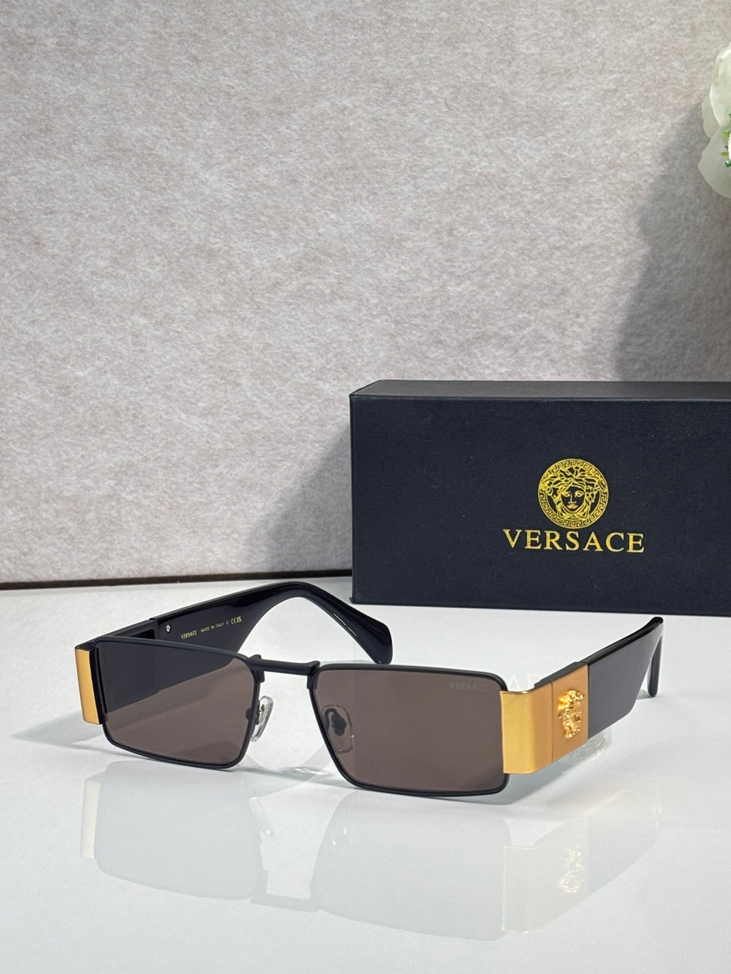 Versace sunglasses with brown lenses, gold-tone and dark blue frame, tortoiseshell sides
