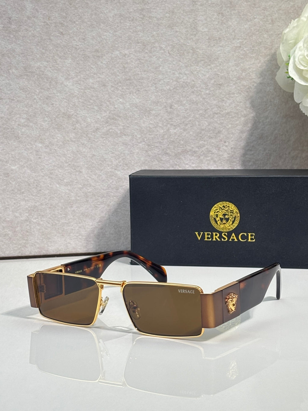 Versace rectangular sunglasses with gold-tone frame, tortoiseshell sides, dark blue lenses