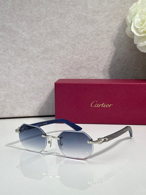 Cartier round eyeglasses with dark blue gradient lenses and silver metal frame