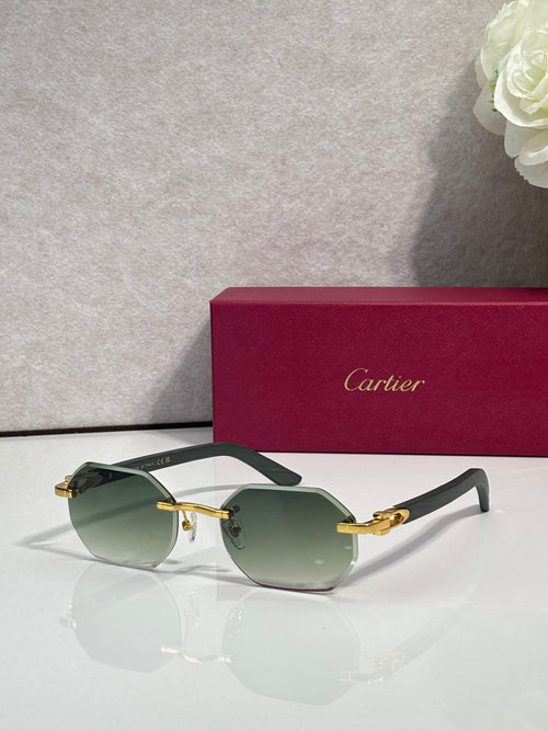 Cartier round eyeglasses with green gradient lenses, gold accents, and dark temples