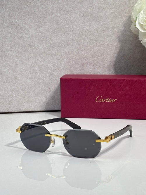 Cartier glasses with dark lenses and black frames, gold-tone hinges and arms