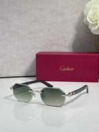 Cartier glasses with green-tinted lenses and dark frame, silver-tone hinges