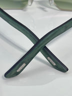 Cartier glasses temple detail: green arms with logo plates