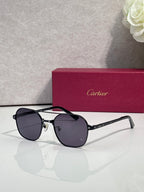 Black-tinted round sunglasses with silver-tone metal frame and dark lenses
