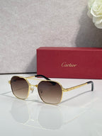 Amber-tinted round sunglasses with gold-tone metal frame and light lenses